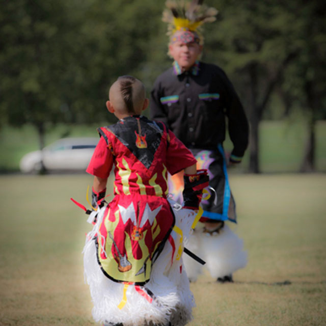 Father and Son Dancing in Traditional Dress